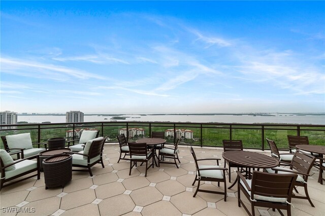 4800 Pelican Colony Blvd Unit 303, Bonita Springs, FL 34134 - view of patio / terrace with a water view and outdoor dining area