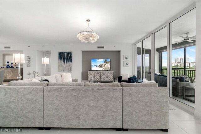 4800 Pelican Colony Blvd Unit 303, Bonita Springs, FL 34134 - living room featuring a chandelier, light tile patterned floors, and a ceiling fan