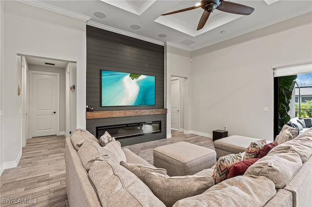 4424 Owens Way, Ave Maria, FL 34142 - living room with light wood finished floors, baseboards, a large fireplace, a ceiling fan, and ornamental molding