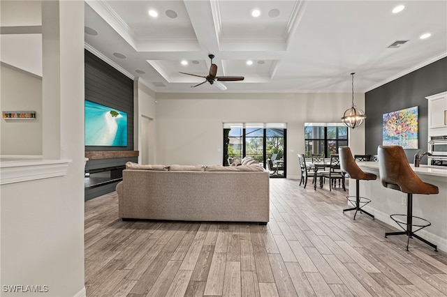 4424 Owens Way, Ave Maria, FL 34142 - living area featuring light wood-type flooring, recessed lighting, crown molding, coffered ceiling, and a ceiling fan