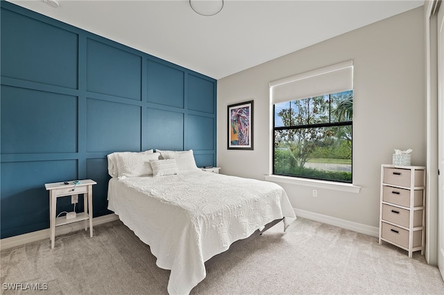 4424 Owens Way, Ave Maria, FL 34142 - bedroom with light carpet, baseboards, and a decorative wall
