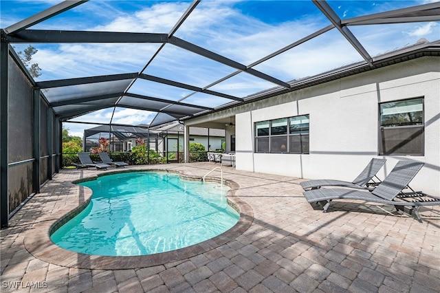 4424 Owens Way, Ave Maria, FL 34142 - outdoor pool featuring a patio and glass enclosure