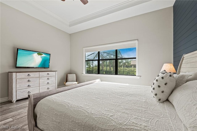 4424 Owens Way, Ave Maria, FL 34142 - bedroom featuring ornamental molding, wood finished floors, a ceiling fan, and baseboards