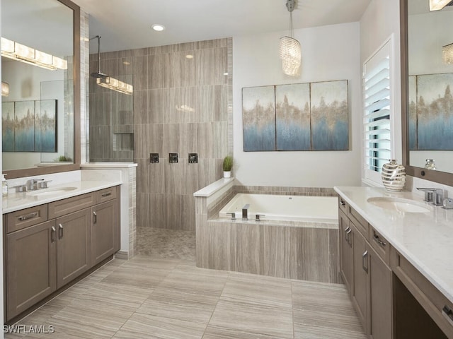 full bathroom with a bath, a walk in shower, two vanities, tile patterned flooring, and recessed lighting
