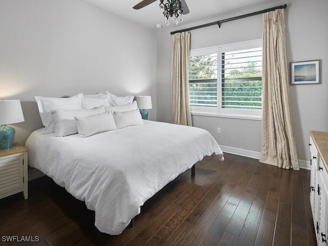 bedroom featuring dark wood-style floors, baseboards, and ceiling fan