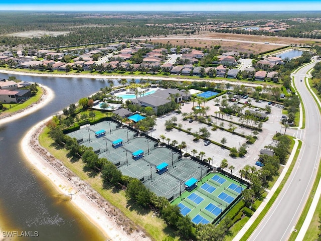 aerial view of residential area featuring a nearby body of water