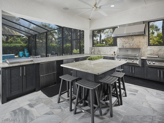 view of patio / terrace with a grill, area for grilling, glass enclosure, and a ceiling fan