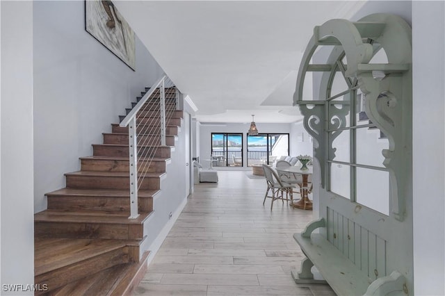 410 La Peninsula Blvd Unit 410, Naples, FL 34113 - foyer entrance featuring light wood-type flooring and stairs