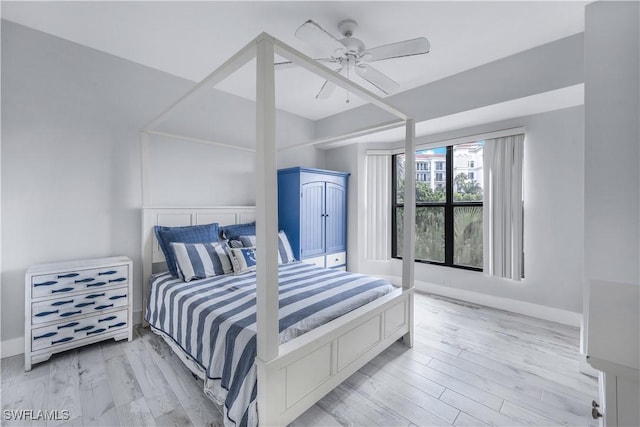 410 La Peninsula Blvd Unit 410, Naples, FL 34113 - bedroom with baseboards, ceiling fan, and wood finished floors