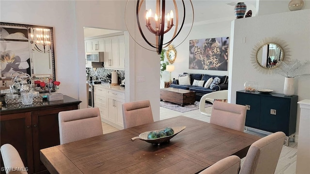 dining room featuring an inviting chandelier and ornamental molding