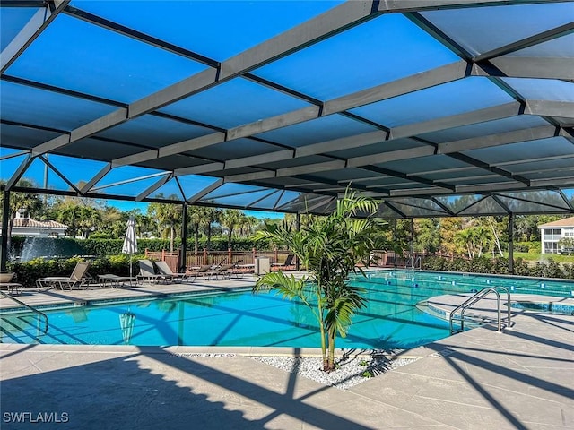 pool with a patio area and a lanai