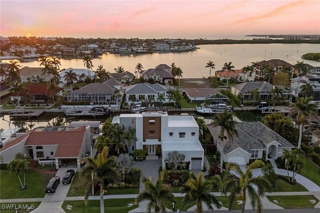 724 Plantation Ct, Marco Island, FL 34145 - aerial view at dusk of a water view and a residential view