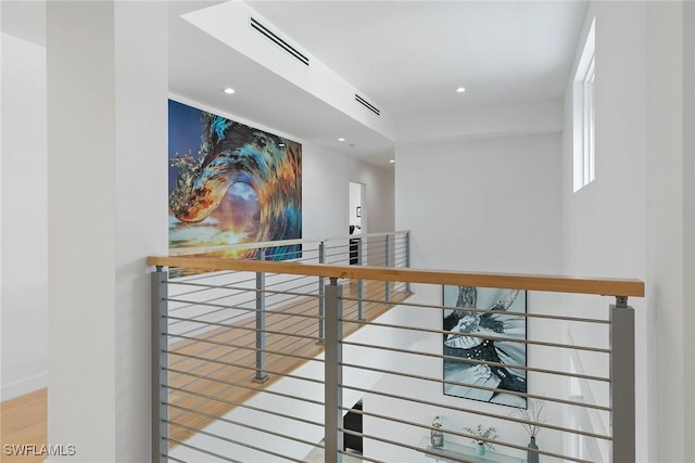 724 Plantation Ct, Marco Island, FL 34145 - hallway with an upstairs landing, recessed lighting, and wood finished floors