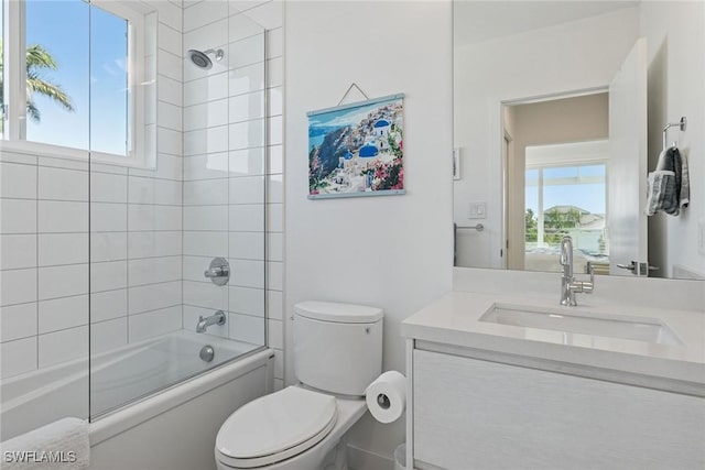 724 Plantation Ct, Marco Island, FL 34145 - full bathroom with healthy amount of natural light, vanity, toilet, and shower / washtub combination