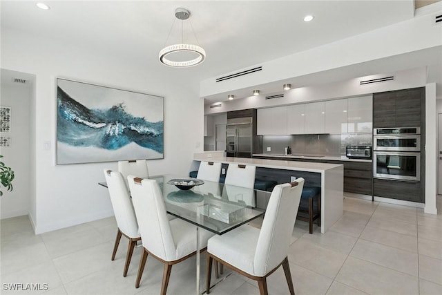 724 Plantation Ct, Marco Island, FL 34145 - dining space with light tile patterned flooring, recessed lighting, and baseboards