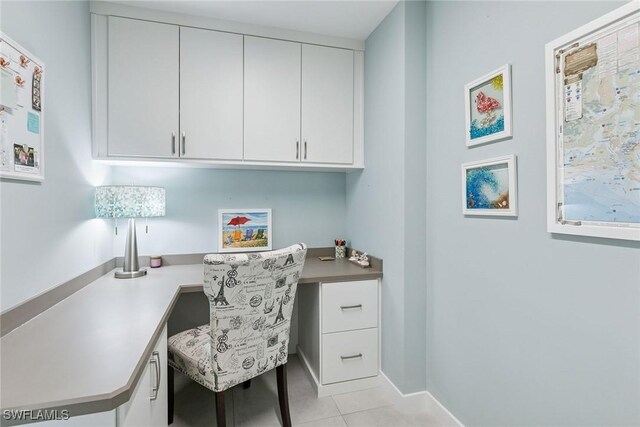 724 Plantation Ct, Marco Island, FL 34145 - office with built in study area, light tile patterned floors, and baseboards