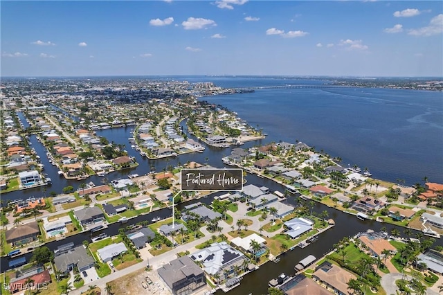 drone / aerial view with a residential view and a water view