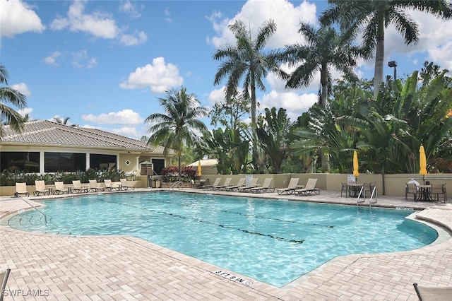 3665 Buttonwood Way Unit 1422, Naples, FL 34112 - pool featuring a patio and fence