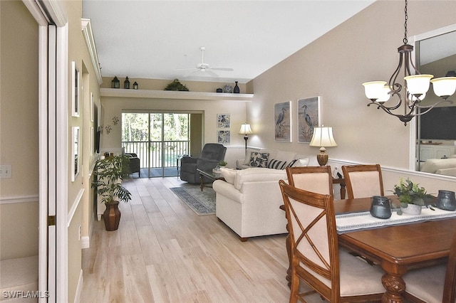 3665 Buttonwood Way Unit 1422, Naples, FL 34112 - living room featuring vaulted ceiling, light wood finished floors, and ceiling fan with notable chandelier