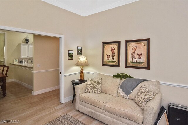 3665 Buttonwood Way Unit 1422, Naples, FL 34112 - living area with light wood-type flooring, baseboards, and crown molding