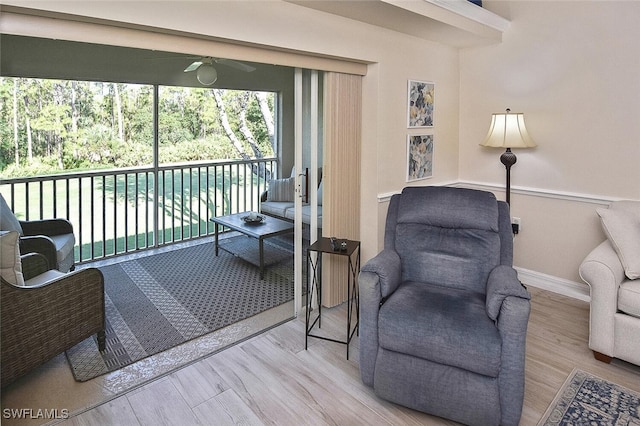 3665 Buttonwood Way Unit 1422, Naples, FL 34112 - living area with baseboards, ceiling fan, and wood finished floors