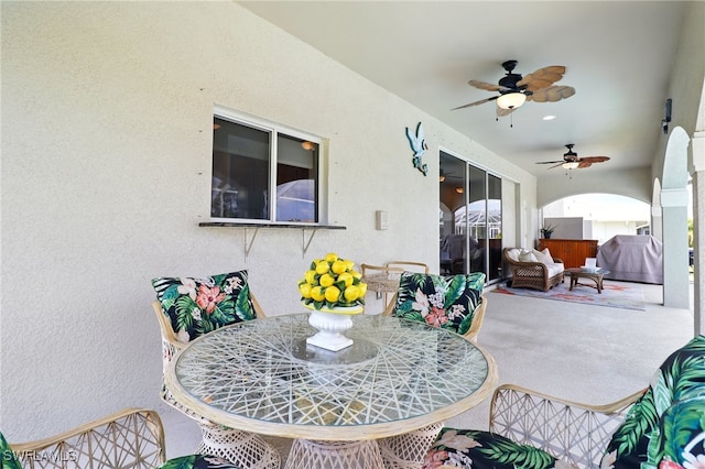 view of patio / terrace with ceiling fan and outdoor dining area