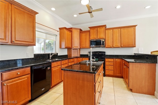 kitchen with crown molding, a center island with sink, a sink, dark stone countertops, and black appliances