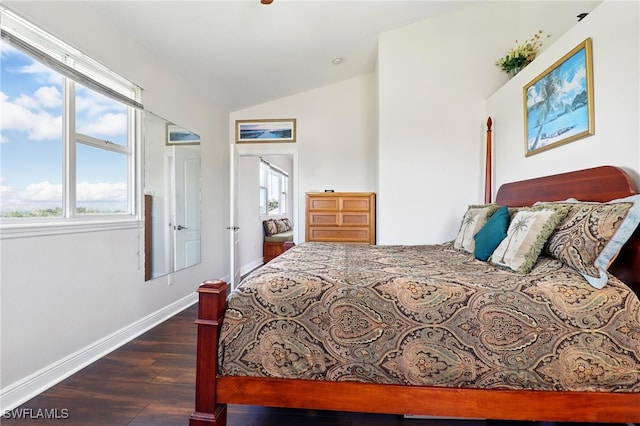 bedroom with baseboards, wood finished floors, and vaulted ceiling