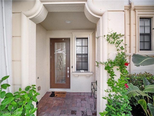 15780 Portofino Springs Blvd Unit 106, Fort Myers, FL 33908 - view of exterior entry featuring stucco siding