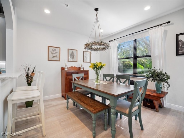 15780 Portofino Springs Blvd Unit 106, Fort Myers, FL 33908 - dining area featuring recessed lighting, baseboards, an inviting chandelier, and light wood finished floors