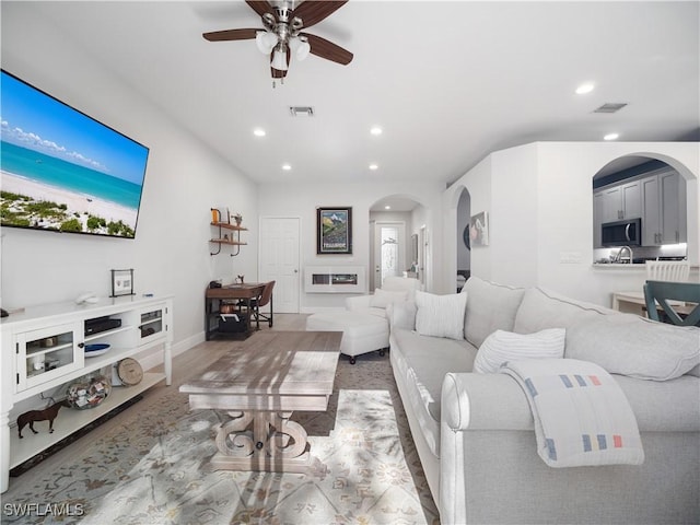 15780 Portofino Springs Blvd Unit 106, Fort Myers, FL 33908 - living area featuring arched walkways, ceiling fan, recessed lighting, and visible vents