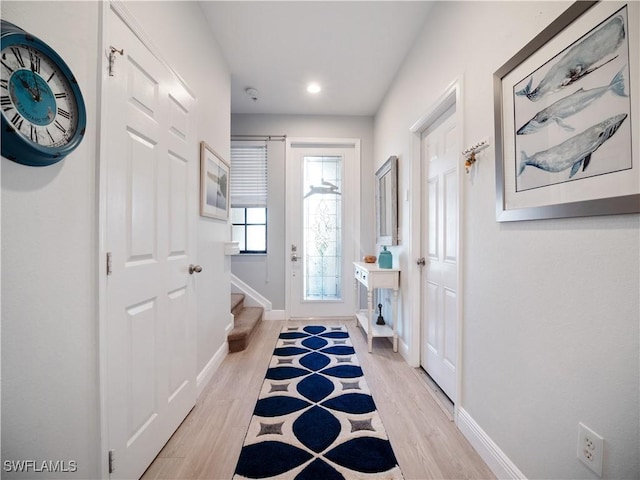 15780 Portofino Springs Blvd Unit 106, Fort Myers, FL 33908 - doorway to outside with recessed lighting, baseboards, stairs, and light wood-style flooring