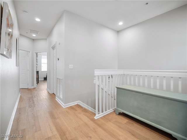 15780 Portofino Springs Blvd Unit 106, Fort Myers, FL 33908 - corridor featuring baseboards, recessed lighting, light wood-style flooring, and an upstairs landing