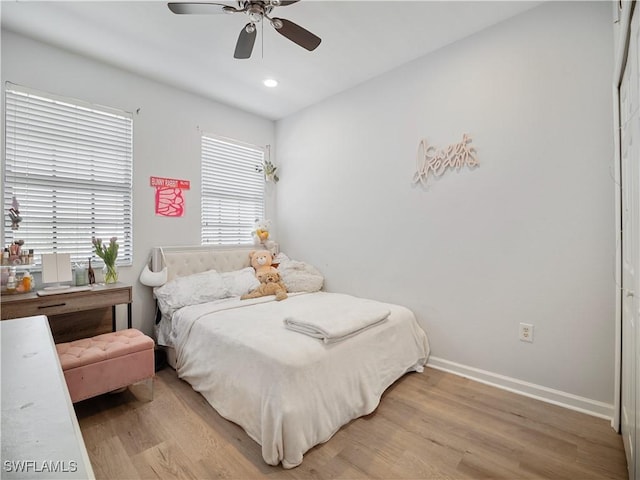 15780 Portofino Springs Blvd Unit 106, Fort Myers, FL 33908 - bedroom featuring recessed lighting, baseboards, a ceiling fan, and light wood finished floors