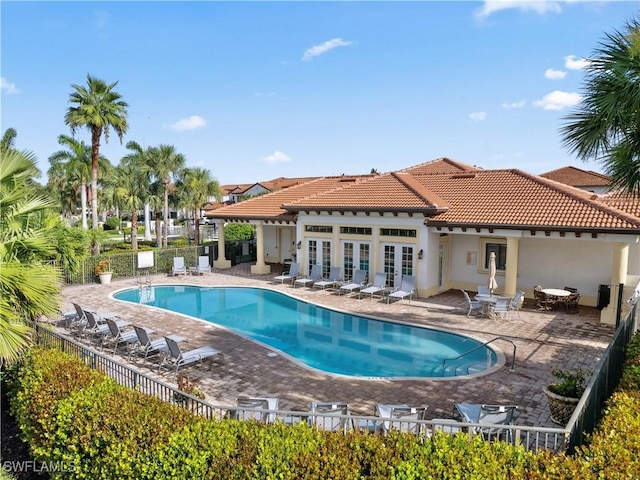 15780 Portofino Springs Blvd Unit 106, Fort Myers, FL 33908 - pool featuring a patio area, fence, and french doors