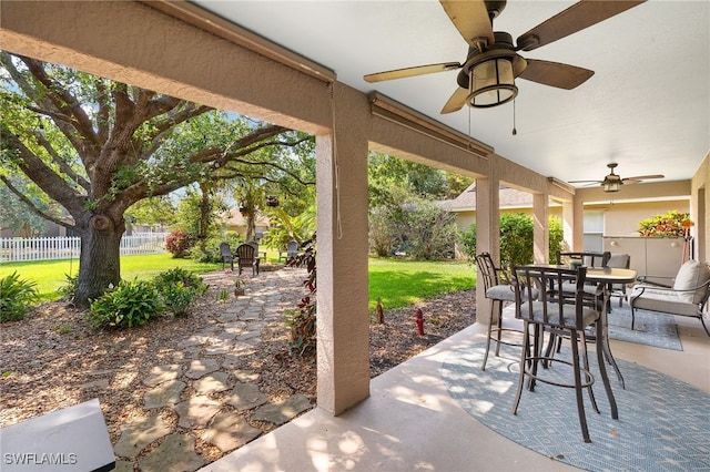 view of patio / terrace with ceiling fan, outdoor dining area, and fence private yard