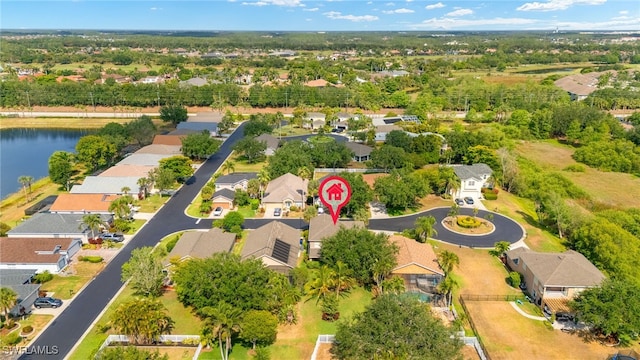 bird's eye view with a residential view and a water view