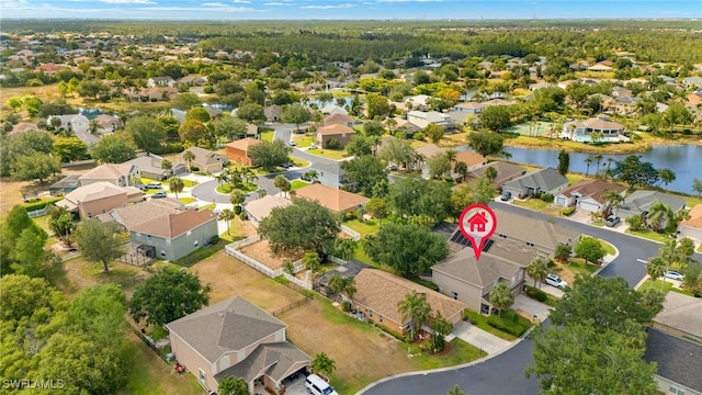 bird's eye view featuring a water view and a residential view