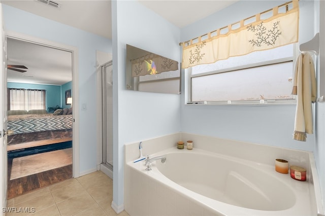 full bathroom featuring tile patterned flooring, a garden tub, visible vents, ensuite bathroom, and a stall shower