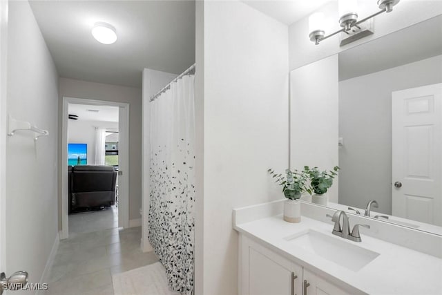 2016 SW 28th Ln, Cape Coral, FL 33914 - full bath with vanity, a shower with curtain, baseboards, and tile patterned flooring