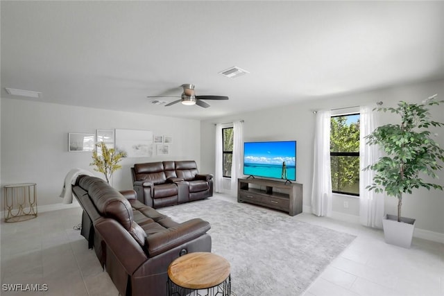 2016 SW 28th Ln, Cape Coral, FL 33914 - living room with light tile patterned floors, visible vents, and plenty of natural light