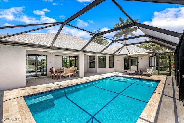 2016 SW 28th Ln, Cape Coral, FL 33914 - outdoor pool with a patio area, glass enclosure, and outdoor dining area