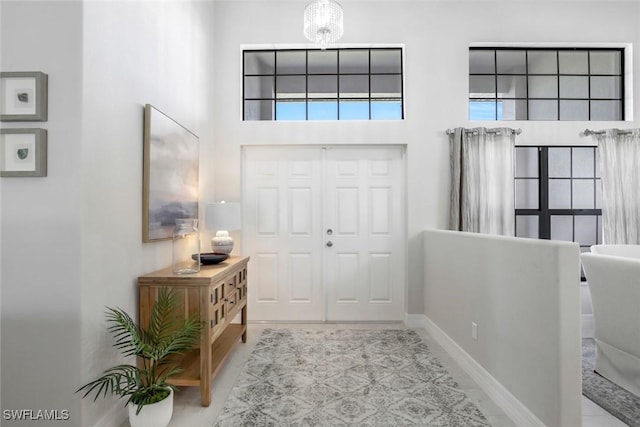 2016 SW 28th Ln, Cape Coral, FL 33914 - foyer with a high ceiling and baseboards