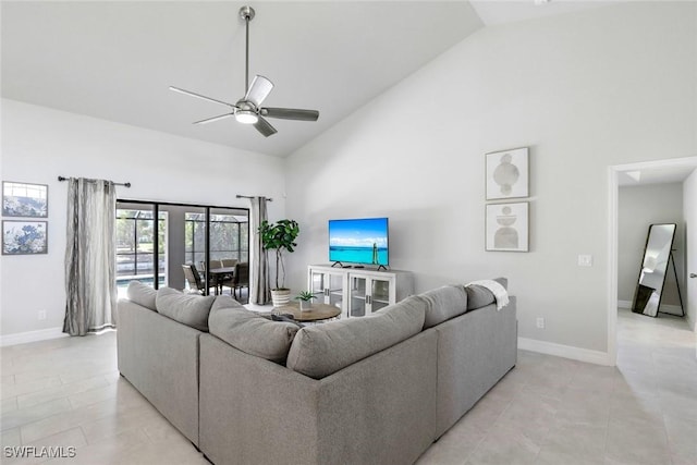 2016 SW 28th Ln, Cape Coral, FL 33914 - living area with light tile patterned floors, baseboards, a ceiling fan, and high vaulted ceiling