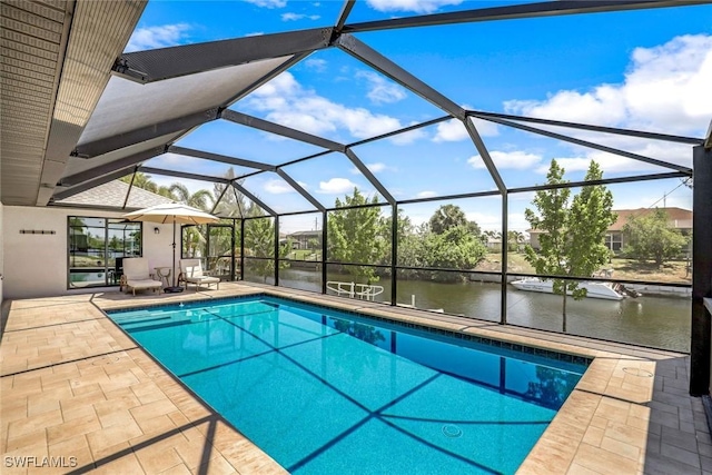 2016 SW 28th Ln, Cape Coral, FL 33914 - outdoor pool featuring a water view, glass enclosure, and a patio