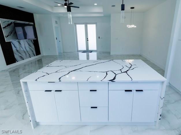 kitchen featuring french doors, marble finish floor, modern cabinets, and white cabinets