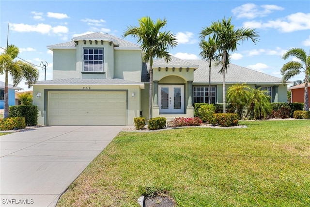 209 SE 3rd Ter, Cape Coral, FL 33990 - view of front of home featuring an attached garage, french doors, concrete driveway, stucco siding, and a front lawn
