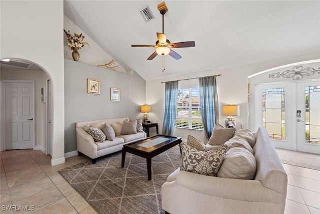 209 SE 3rd Ter, Cape Coral, FL 33990 - tiled living room with french doors, visible vents, vaulted ceiling, arched walkways, and a ceiling fan