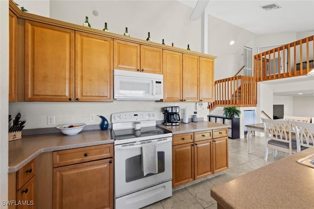 209 SE 3rd Ter, Cape Coral, FL 33990 - kitchen featuring high vaulted ceiling, brown cabinetry, visible vents, white appliances, and light tile patterned flooring