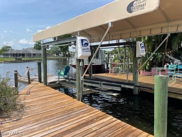 303 Georgia Ave, Fort Myers, FL 33905 - dock area featuring a water view and boat lift